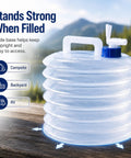 Collapsible Water Container With Spigot For Camping And Road Trips, Large Capacity Portable Folding Jug on table.