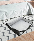 Lowkey Huge Underbed Storage Container And Clothes Organizer features grippy handles, black fabric, and a spacious open design for storage.
