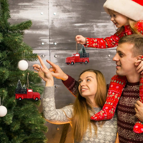 Family decorating tree with Three Pack Totally Vintage Red Truck Christmas Ornaments With Mini Christmas Trees.
