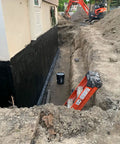Kickass Rubberized Waterproofing Sealant For Foundations And Flat Low Slope Roofs Concrete Wood Metal Black Five Gallon applied to a foundation wall.