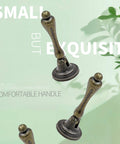 Antique Bronze Tear Drop Cabinet Pulls Set of 6 With Screws for Drawers Dressers and Wardrobes with green background