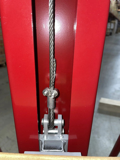 Close-up of steel cable mechanism on Full Size Manual Hand Winch Work Positioner Lift Truck For Warehouse Steel Frame.