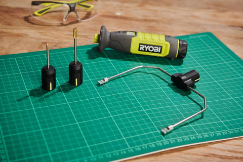 4V Cordless Hot Foam Cutter With 2.0Ah Battery Killer Cuts For Model Making And Crafts with various wire tips on a cutting mat.