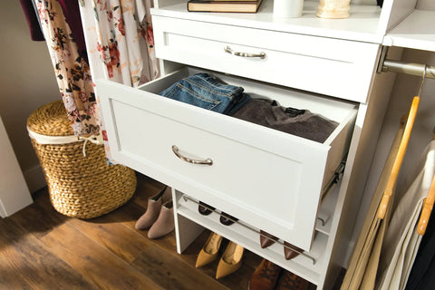 Open drawer in closet tower showing SuiteSymphony Wood Closet Drawer Add On Accessory For 25 Inch Wide Storage Tower Deep 10 Inch Tall Shaker Style Drawer Pure White Finish No Brainer Pick For Undergarments Socks Shirts And Small Garments with folded jeans and gray shirt inside.