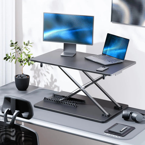 Ergonomic Standing Desk Converter With Quick Height Adjustment, 25.16 Inch Wide By 15.75 Inch Deep, Sit Stand Laptop And Monitor Stand, No Assembly Required, No Fuss Setup For Home Office And Desk Use, Black on office desk with monitor and laptop