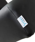 Sierra Comfort Standard Electric Lift Massage Table With 3 Inch High Density Foam Deck And Water Resistant PU Leather Upholstery close-up of black upholstery.