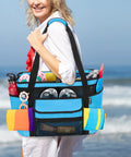 Person holding XL Beach Tote Bag With Insulated Cooler Compartment And Wet Dry Separation, on beach, filled with beach gear