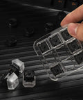 Hand holding Nine Key Cherry MX Switch Tester For Mechanical Keyboards with nine distinct switches on clear acrylic base.