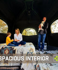 Roomy Six Person Camping Tent With Heavy Duty Blackout Layer Blocks Bright Morning Sun And Keeps Things Cool For Your Crew Includes Full Rainfly For Smooth Weekend Getaways, spacious interior with family sitting.
