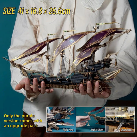 Person holding Vintage Steampunk DIY Mechanical Model Kit for the Corsair Airship in Deep Green, showing hollow frame and sails.