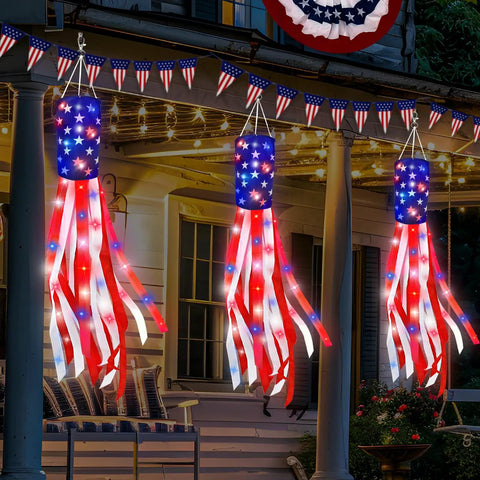 Three Pack 60 Inch American Flag Windsocks With Red White Blue LED Lights For Outdoor Yard Decor Show Off Fourth Of July And 250th Anniversary Patriotic USA Heavy Duty Memorial Day hanging in yard at night.