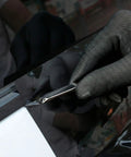 Person using vinyl cutter with All-In-One Vinyl Wrap Heat Gun Kit For Cars And Window Tinting, 1800W 110V Hot Air Tool