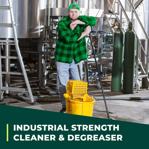 Worker using industrial cleaner and degreaser concentrate for heavy duty grime remover on equipment, with mop bucket, in facility.