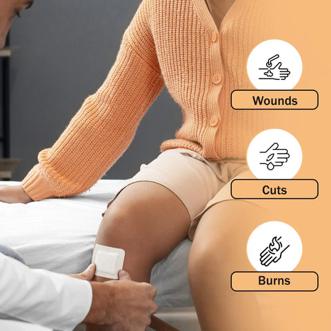 Person applying Bordered 2x2 Sterile Adhesive Gauze Pads for Wound Protection Easy Peel Square Island Style on a leg.