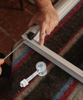 Heavy Duty Sliding Door Roller Kit With Double Bearing Steel Wheels being installed with a screwdriver on a sliding door track.