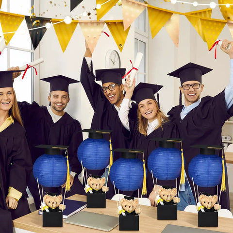 Group with Six Set Graduation Table Centerpieces With Hot Air Balloon Paper Lanterns And Tassel Caps Royal Blue Decor