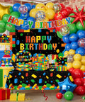 Nail The Party Vibe With This 310 Piece Building Block Birthday Decorations Kit Serving Twenty Five Guests Including Balloons Backdrop Centerpieces And Cake Toppers, vibrant party setup with balloons and tableware.