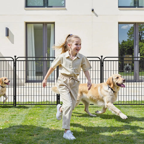 Child and dogs playing in a yard enclosed by Beefy Iron No Dig Garden Fence System With 16 Panels Spanning 34 Point 7 Feet And 40 Inch High Includes 2 Gates Anti Dig Gravity Lock Indoor Outdoor Dog Fence For Yard RV Camping Black