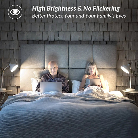 Couple in bed with lamps using dimmable vintage LED Edison bulbs 8W to 100W equivalent, ST58 cool white 4000K, 1200 lumens, clear glass.