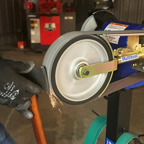 Heavy Duty 2X48 Belt Bench Grinder Attachment With 8 Inch Contact Wheel And 7 Inch Disc in action sharpening a knife with sparks.