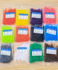 Massive 1200 Pack Multicolor Zip Ties 4 Inch Self Locking Nylon Cable Ties Set In 12 Colors For Home Office Garden Garage Workshop UV And Heat Resistant PA66 Durable Easy To Use Cable Management For Cables And More displayed in packaged sets on a wooden surface.