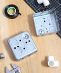 12 Pack 4 Inch Square Electrical Boxes Kit for Plug and Play Wiring Projects, 1-1/2 Inch Deep, Silver Galvanized Steel, 21 Cu In Capacity, Grounding Wire Ready, Includes 36 Screws for Quick No Fuss Organized Junctions on workbench
