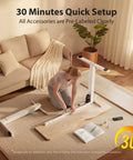 Person assembling Electric Height Adjustable Standing Desk 48x24 Inches With White Frame And Maple Top in living room
