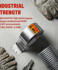 Heavy Duty Aluminum Foil Duct Tape 2 In By 20 Yd Pro Grade High Temp Seal For HVAC Vents And Insulation DIY Friendly Stops Air Leaks And Resists Extreme Heat For Home Repair Silver in industrial setting with gloves.