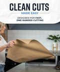 Heavy Duty Steel Butcher And Kraft Paper Roll Dispenser With Razor Sharp Cutter Blade Built For Kitchen Wrapping And Craft Room Jobs That Hits Different Every Use Top Shelf Quality You Will Dig Smooth Cuts Guaranteed in use, demonstrating clean cuts with brown butcher paper.