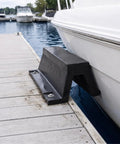 Rubber Arch Dock Shield Bolt Down Kit for Boat Impact Protection attached to dock near moored boat.