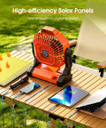 Rechargeable Solar Camping Fan with LED Lantern charging devices on a wooden table outdoors with solar panel