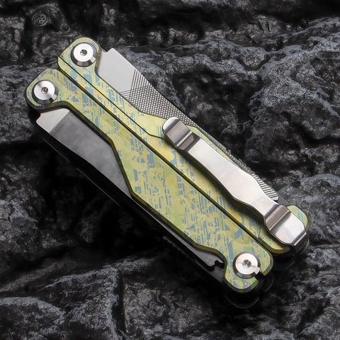 Folded Ultra Lightweight Titanium Alloy Multitool Pliers With Camouflage Finish on rock background