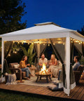 Evening scene of 12x12 Pop Up Gazebo On Clearance, Easy Up Metal Frame Outdoor Shelter With Waterproof Canopy, Mosquito Netting, lit interior.
