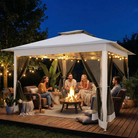Evening scene of 12x12 Pop Up Gazebo On Clearance, Easy Up Metal Frame Outdoor Shelter With Waterproof Canopy, Mosquito Netting, lit interior.