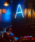 Led Neon Letters Sign Warm White Wall Decor Alphabet A To Z And 0 To 9 Marquee Letter Lights For Parties Weddings Valentines Day Home Bar Lounge And Creative Room Accent illuminated letter 'A' on dark wall