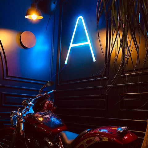 Led Neon Letters Sign Warm White Wall Decor Alphabet A To Z And 0 To 9 Marquee Letter Lights For Parties Weddings Valentines Day Home Bar Lounge And Creative Room Accent illuminated letter 'A' on dark wall