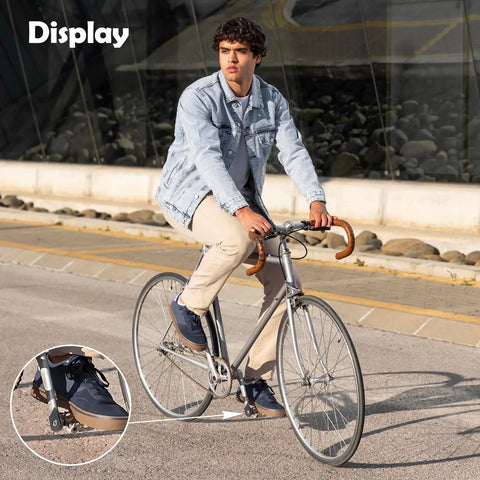 Man biking with Black Bike Crank Boot Protectors, 4 Pack Silicone Crankset Guards on road bike