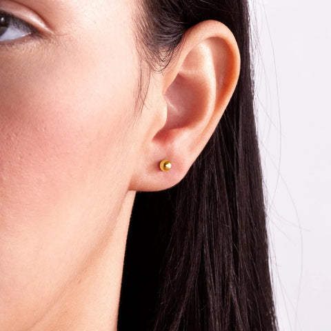 Real 14K Gold Ball Screw Back Stud Earrings For Women And Men 4mm Solid Yellow Gold Hypoallergenic And Hand Polished For Everyday Comfort And All Day Wear on ear
