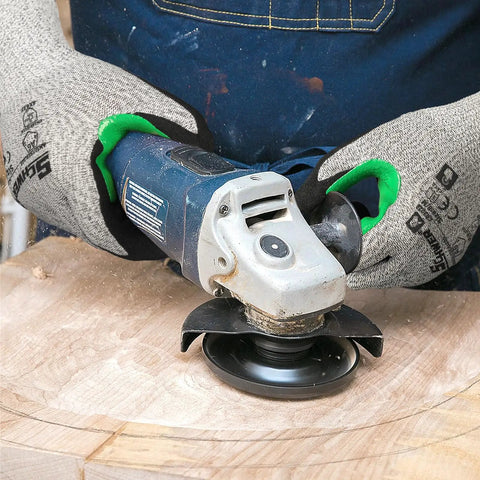 Person wearing 12 Pairs ANSI A6 Cut Resistant Work Gloves With Sandy Nitrile Coating using a grinder on wood, Large size