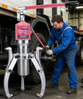 Heavy Duty Hydraulic Bearing Puller 3 Jaw Hub Separator 10 Ton 22000Lb Capacity Rust Proof High Strength Steel Works Great For Cars Trucks Gears Bad Ass Tool Mechs Love This Thing Handles Heavy Loads Without Leaking Like Cheap Alternatives. mechanic using 3 jaw steel puller on truck hub