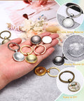 25 Millimeter Glass Cabochon Keychain Making Kit With 20 Pcs Pendant Setting Trays Blank Bases For Key Ring Crafting Photo Resin Jewelry Supplies Red Copper Finish Cool DIY Gift For Personalizing Bags And Accessories showing various colored trays and glass cabochons on a table and in hand