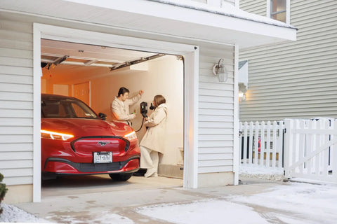 Fast 48 Amp Level 2 EV Charger For Home Hardwired Wall Mount EVSE in garage charging a red electric vehicle