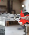 Close-up of 5-Blade Sheet Metal Crimper Hand Tool for ductwork and stove pipe, crimping 24 gauge steel sheet in workshop.