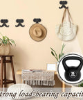 Heckin Durable Four Piece Cast Iron Beard Wall Hooks For Old School Farmhouse Charm And Dang Tough Rustic Decor Hanging Rack For Coats Scarves Towels Keys With Mounting Hardware Included, displayed with hats and bags.