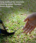 Hand securing tent with Beefy Heavy Duty Metal Tent Stakes Set 17 Pack for outdoor decorations and gardening