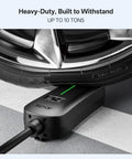 Heavy-duty Level 1 And Level 2 J1772 EV Charger With 25 Foot Extension Cord under car tire showing durability.