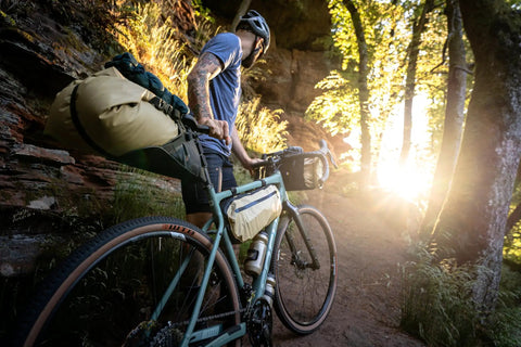 Cyclist on trail with Cabezon FB 6 Frame Bag For Bikes, 6L Waterproof Storage Pack For Commuting And All Terrain Riding, Reflective Trim