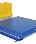 Heavy Duty Electric Hydraulic Scissor Lift Table With 48 By 48 Inch Deck And 10000 Lb Capacity Built Tough For No Sweat Warehouse Hustle And Busy Factories Featuring Certified Safety Guards, blue platform with yellow safety guard.
