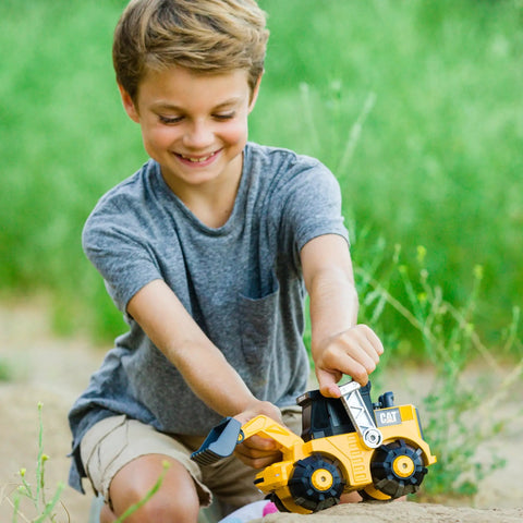 Child playing with Unstoppable Movers Front Loader With Realistic Lights And Sounds Motion Drive Technology Working Features Interactive Kid Friendly Construction Play For Ages 3 Plus
