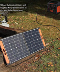 Professional 20 Foot 14 Awg Anderson To 8020 Solar Extension Cord connecting solar panels to a portable power station outdoors.